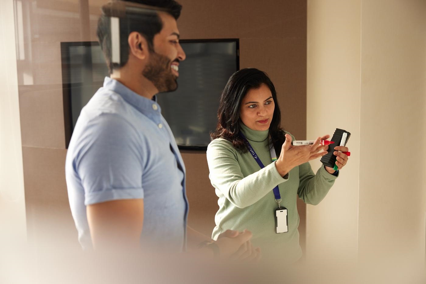 People meeting and working together using whiteboard