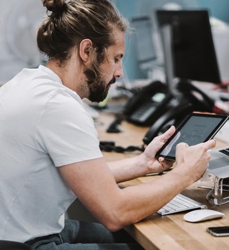 guy working with tablet at the office